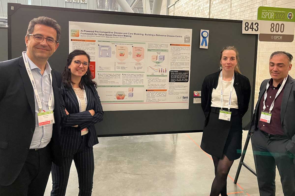 The Quinten Health team (Alexandre Templier, Mélissa Rollot, Pauline Guilmin and Billy Amzal) is posing in front of the poster "AI-Powered Pre-Competitive Disease and Care Modeling: Building a reference Disease-Centric Framework for Value-Based Decision Making" at ISPOR global 2023.